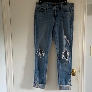 Cute ripped lucky jeans with embroidered flowers